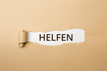 HELFEN Schriftzug - aufgerissenes Papier