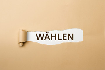 WÄHLEN Schriftzug - aufgerissenes Papier