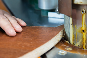 Carpenter works for Edge Banding Machine In workshop