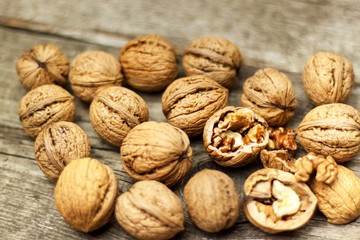 Walnuts on an old wooden board. Healthy food. Autumn harvest.