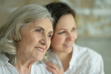 senior mother with adult daughter