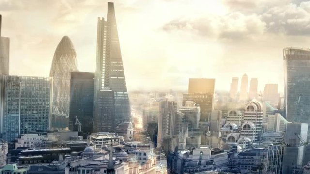 City of London in early morning, sunrise. Business and financial district and Canary Wharf banking aria at the background 