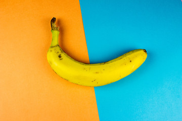Fresh, yellow bananas on the multicolor  background. Healthy sweet vegetarian food concept