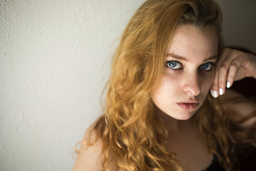 Naklejka premium Red Haired Woman Looking at Camera