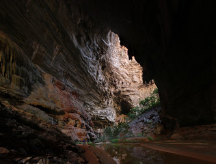 The entrance of a cave in southeast Brazil with researchers ready to explore