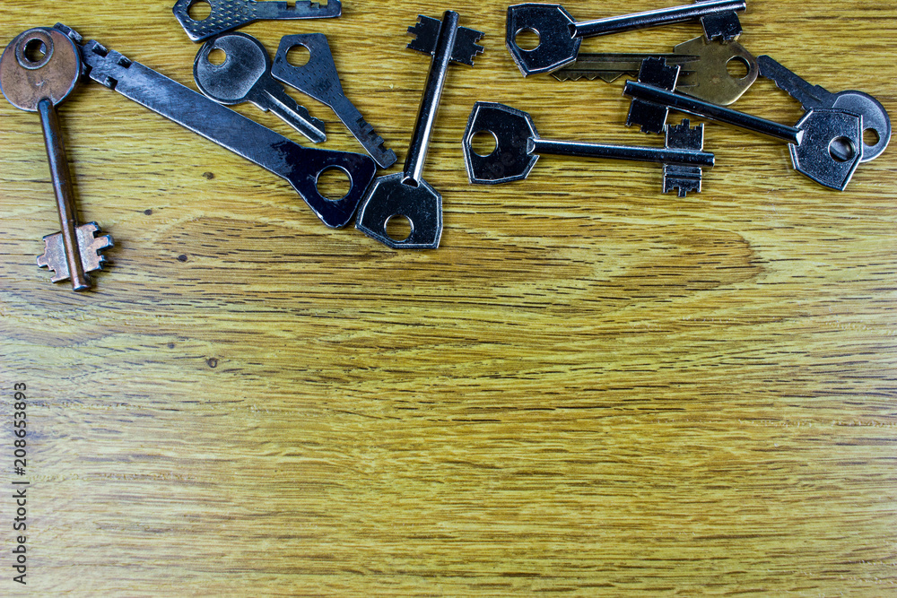 Poster different keys on a table. empty space for text and design.