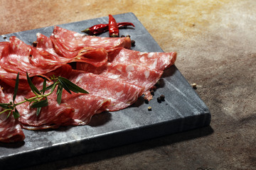 thinly sliced salami . delicious snack rustic salami