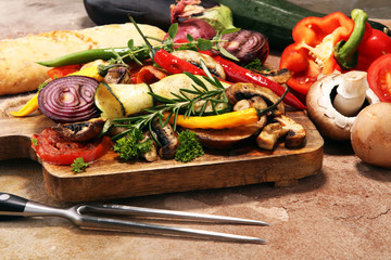 Grilled vegetables. Tomatoes, zucchini, bell pepper and fresh herbs.