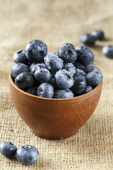 ripe organic bog whortleberry in a wooden plate