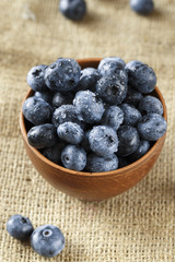 ripe organic bog whortleberry in a wooden plate