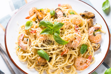 Pasta spaghetti with seafood and cream sauce.