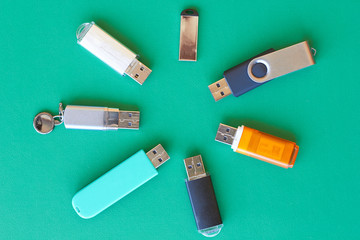 A lot of usb flash drive lie on the table.