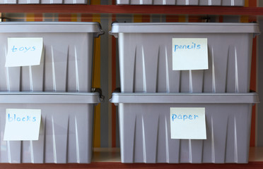 Plastic containers for storing toys and accessories.