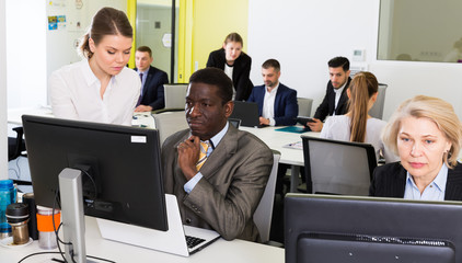 Fototapeta premium Business people working in open plan office