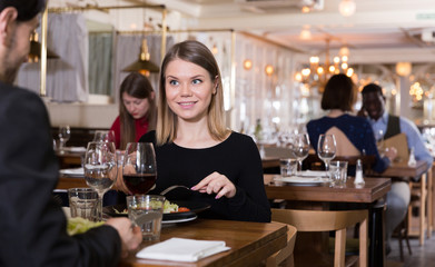 Woman with male colleague in restaurant