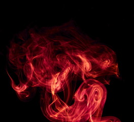 Obraz na płótnie Canvas Red smoke on black background
