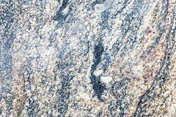 Granite, basalt or marble stone crystal texture of polished gravestone. The macro shot is made by means of stacking technology