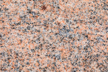 Granite, basalt or marble stone crystal texture of polished gravestone. The macro shot is made by means of stacking technology