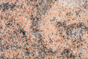 Granite, basalt or marble stone crystal texture of polished gravestone. The macro shot is made by means of stacking technology
