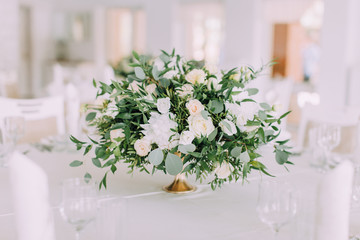 Flower decorations of guest tables at the wedding