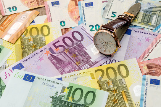 Clock on euro banknotes. close up .
