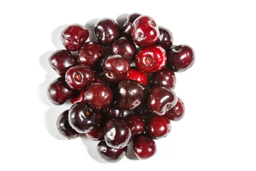 Pile of sweet cherry isolated on white background.