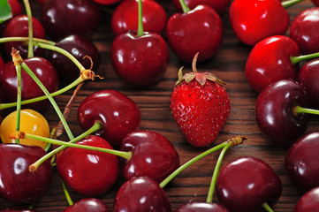 Berries of cherries and strawberries