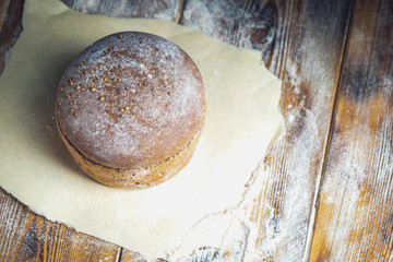 freshly baked bread on dark gray kitchen table, top view Rustic backround