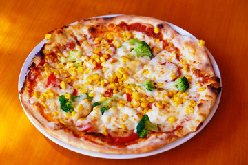 Fresh baked pizza, shallow depth of field.