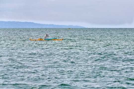 Filipino fisherman in a double-outrigger paraw. North Bays Bay-Negros Oriental-Philippines. 0528