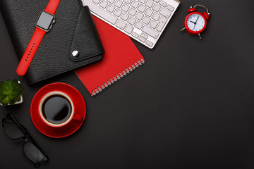 black background red coffee cup note pad alarm clock flower diary scars keyboard corner blank space...