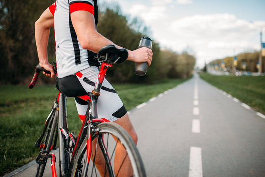 Bycyclist in helmet and sportswear on bike workout