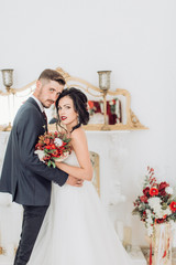 Beautiful couple honeymooned in a green garden 