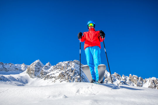 Young happy skier ready for skiing on the top of  Alps.