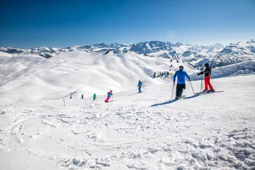Fotobehang  Beautiful winter landscape. People skiing in Hoch Ybrig ski resort, Switzerland, Europe © Eva Bocek
