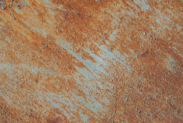 surface of rusty iron with remnants of old paint, chipped paint, orange texture, background