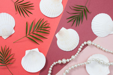 Tropical flat lay with seashells and pearls