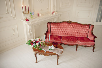 baroque style interior with red luxury sofa and table in the middle top view