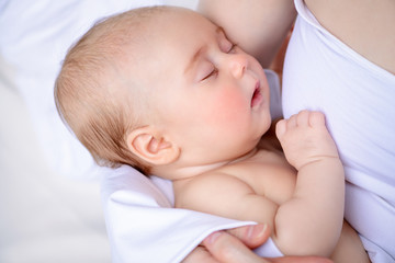 baby sleeping on hands