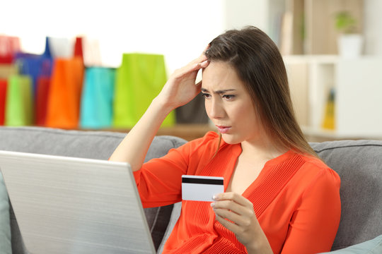 Worried shopper buying online with credit card