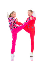 Girls gymnasts perform exercises.