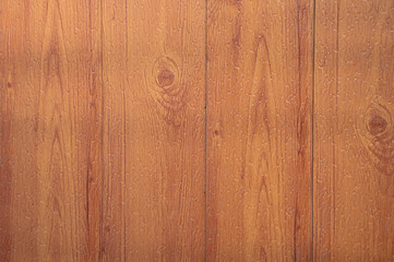 Dyed light brown wood texture. The effect of wet drops.