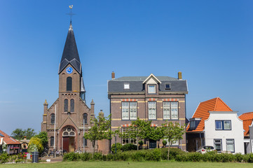 Fototapeta premium Martinus church and old houses in Oudeschild on Texel island, The Netherlands