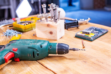 carpentry workshop drill and other tools lie on the table