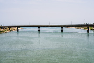 Obraz premium Great road bridge over river without day cars.