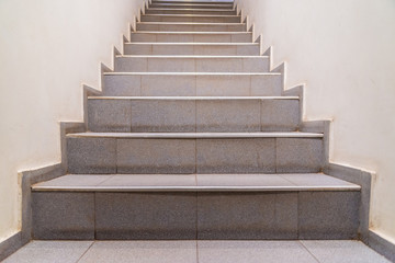 Fototapeta na wymiar Stairs. Abstract steps. Stairs in the city. Granite stairs. Stone stairway often seen on monuments and landmarks, wide stone stairs.