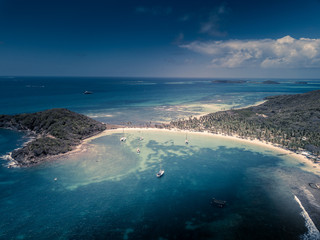 Aerial view of Mayreau beach in St-Vincent and the Grenadines - Tobago Cays. The paradise beach with palm trees and white sand beach