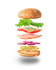 Fresh sandwich with flying ingredients isolated on white background