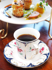 Cup of coffee and dessert on the table