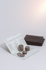 stack of coins and account book bank on the table